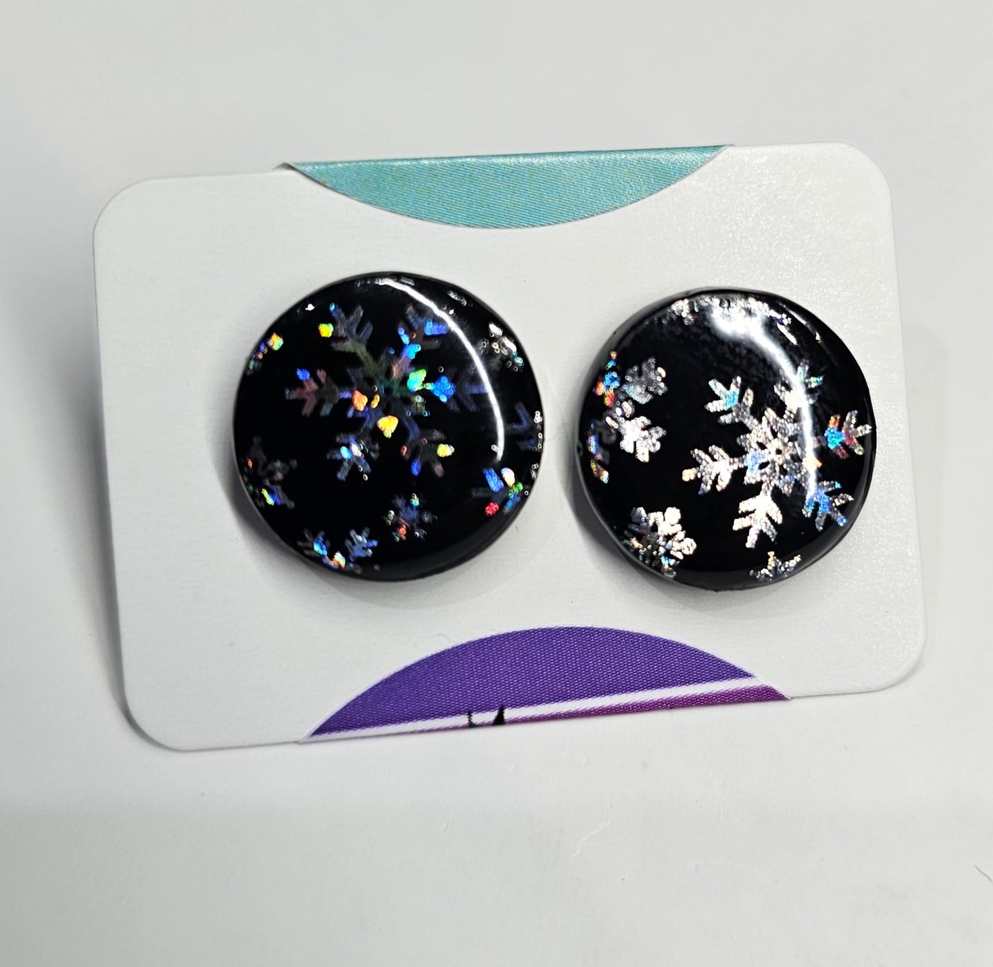 Round black and silver snowflake stud earrings