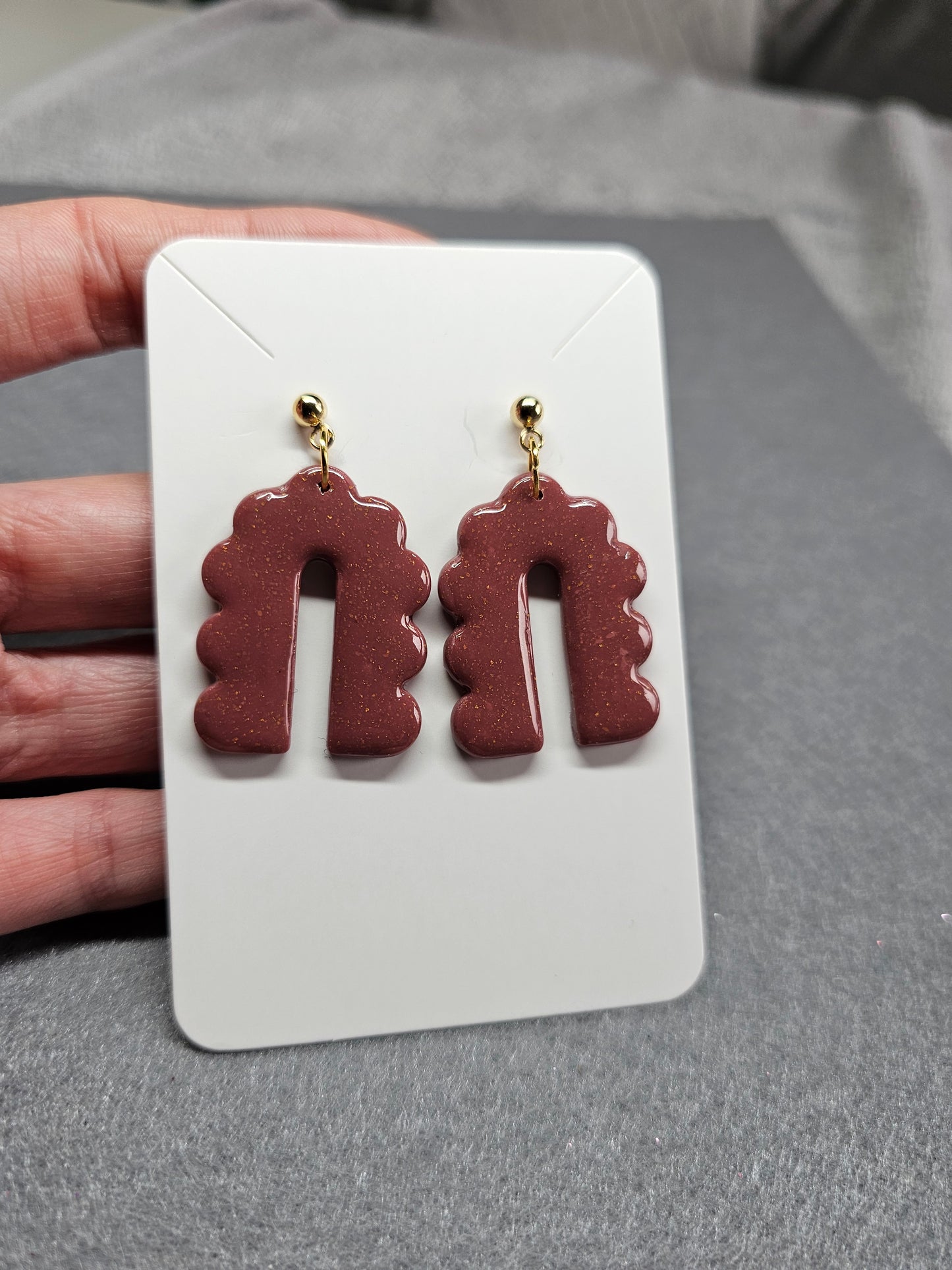 Curved arch burgundy earrings