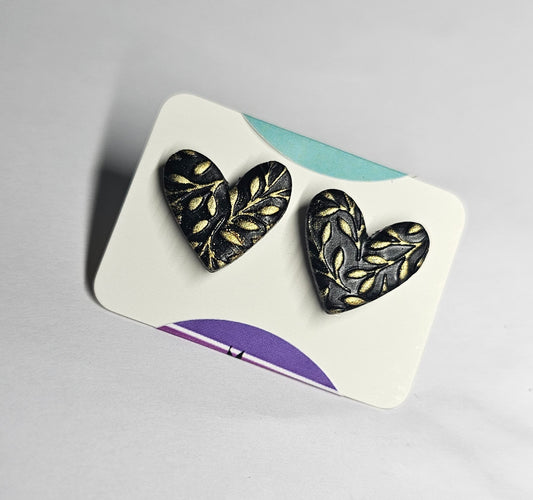 Black and gold heart studs