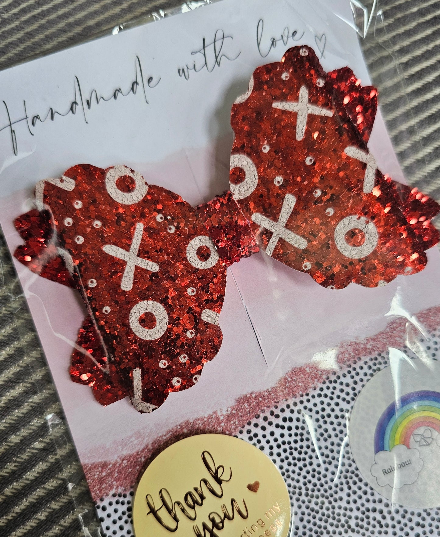 Red glitter noughts and crosses scalloped hair bow