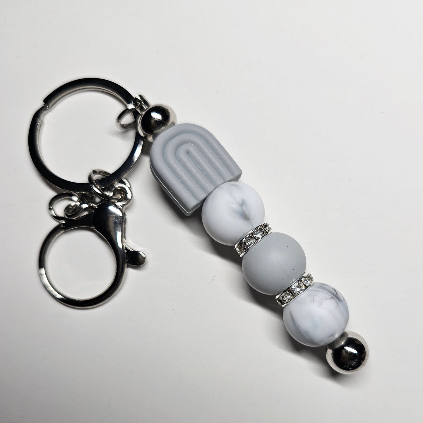 Grey rainbow keychain