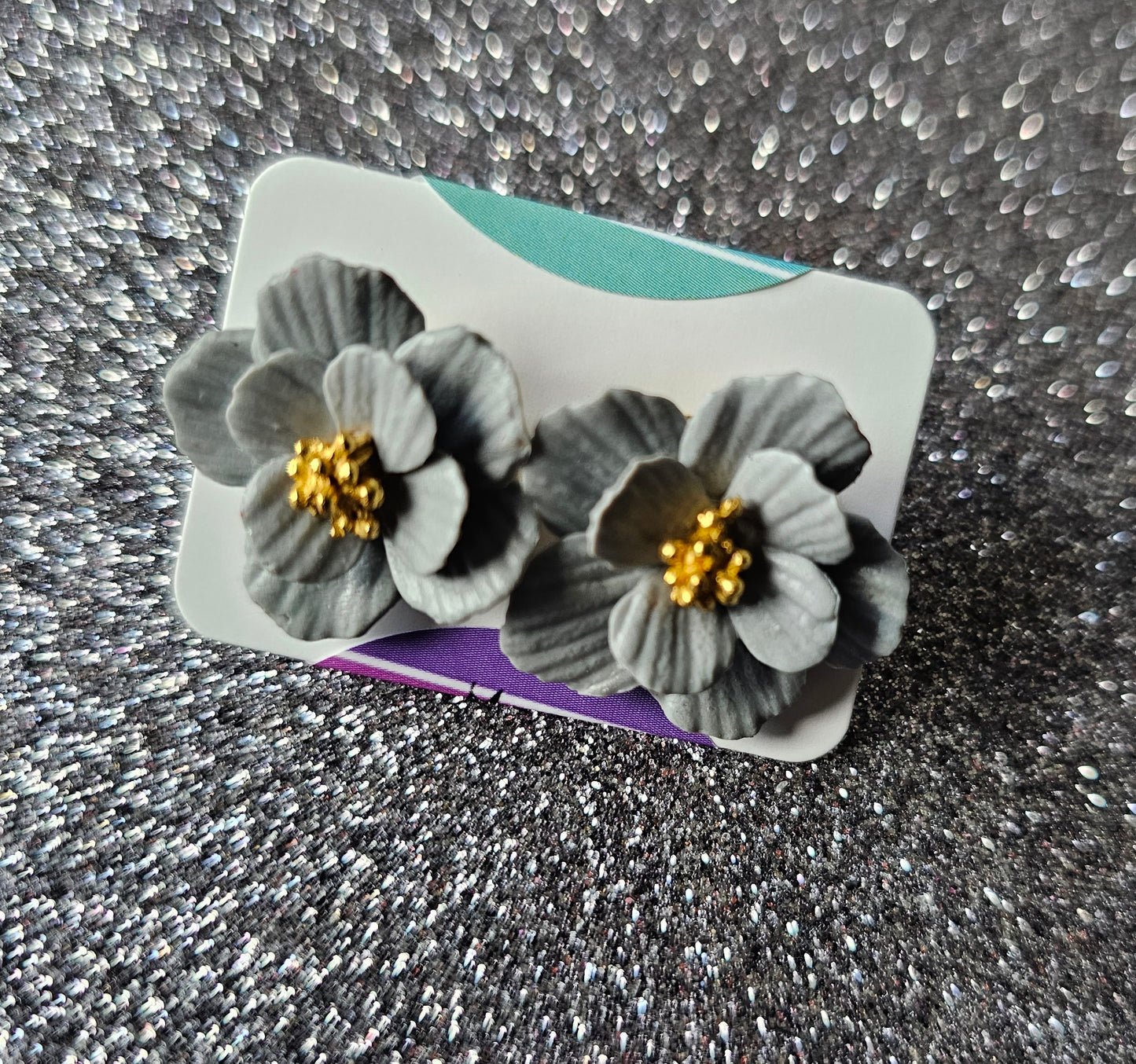 Grey/blue flower stud earrings